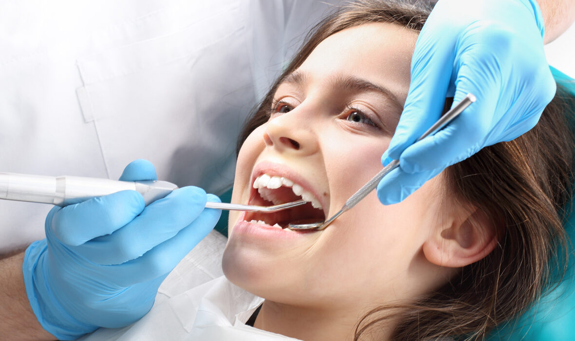 Child in the dental chair dental treatment during surgery