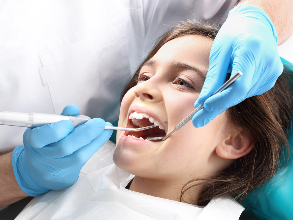 Child in the dental chair dental treatment during surgery